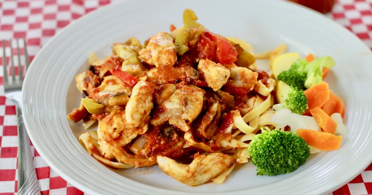 pasta with broccoli on white ceramic plate