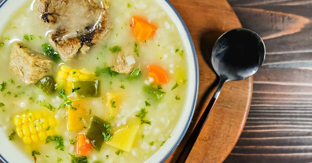 a bowl of soup with a spoon