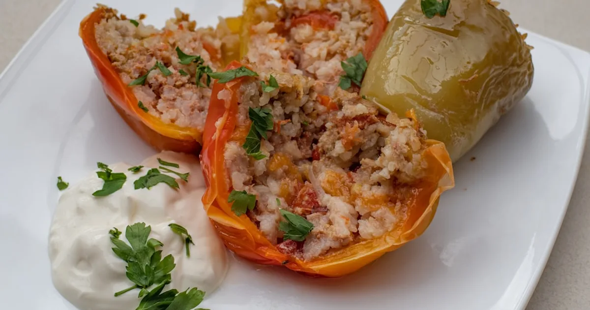 a white plate topped with stuffed bell peppers