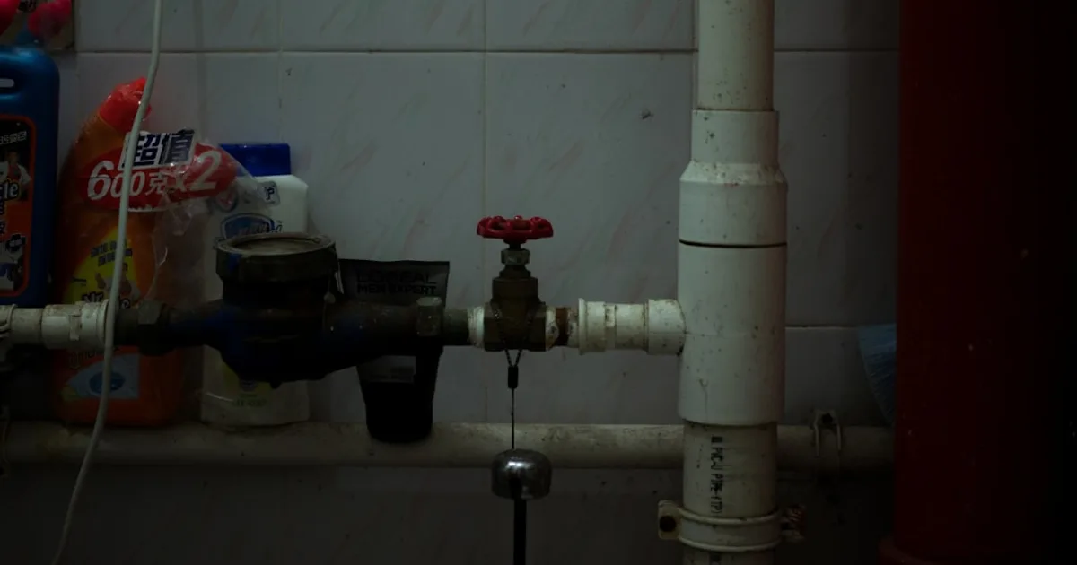 Pipe under a sink with visible connections