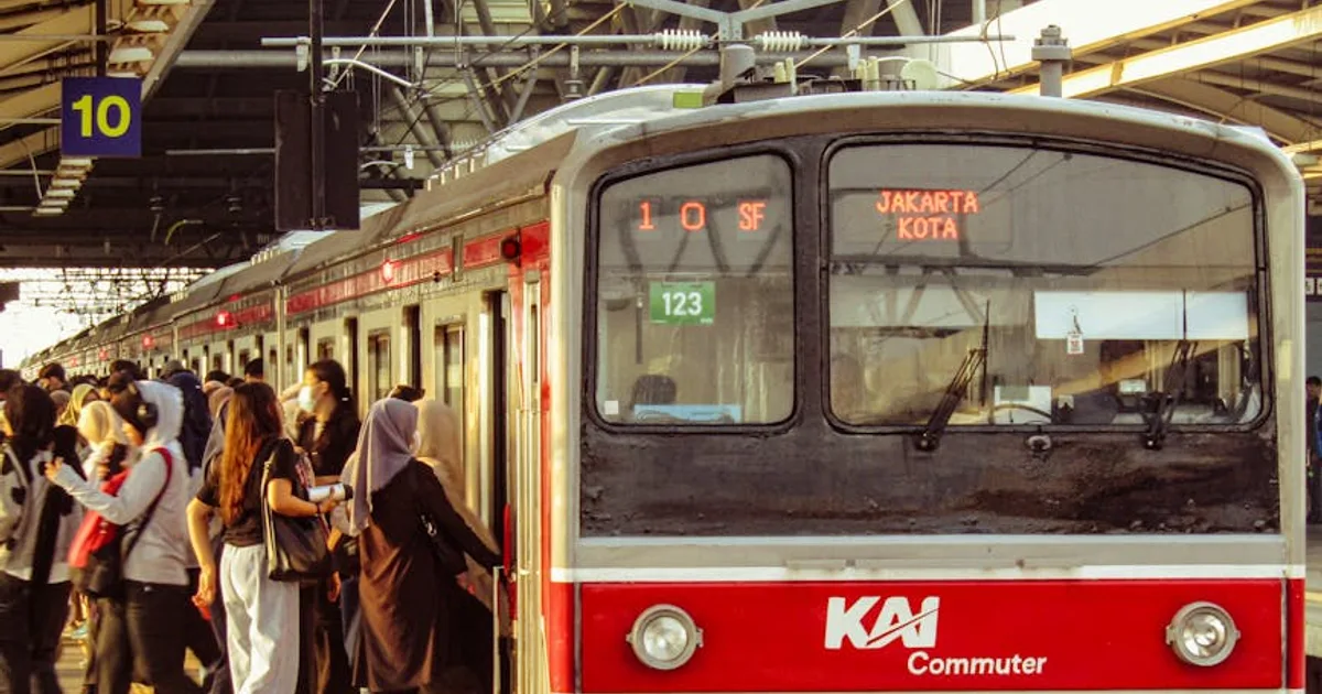 Commuters boarding a KAI train during the day at Jakarta Kota Station, Indonesia.